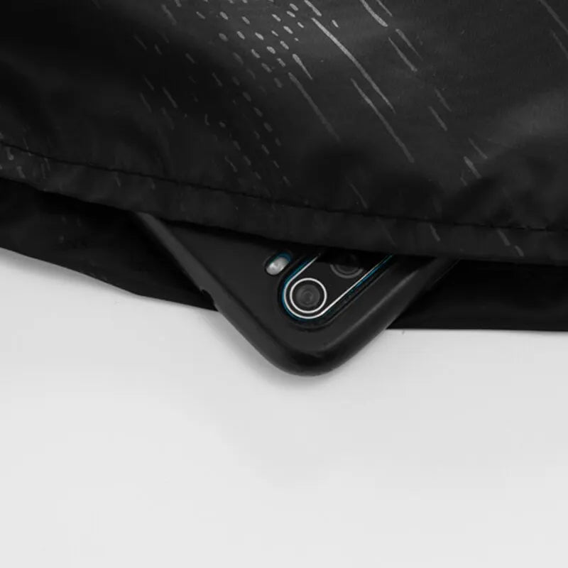 Close-up of a black phone case on a white surface